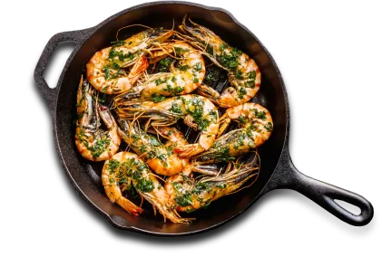 A sautee pan full of shrimp