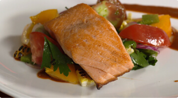 Salmon with heirloom tomatoes and charred corn and peppers